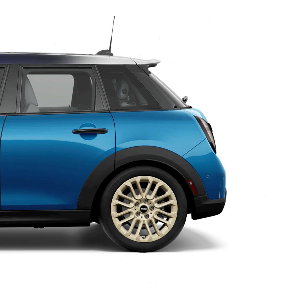Side view of the rear of a MINI Cooper S 4 Door in Icy Sunshine Blue, parked on a blank white surface with its shadow underneath it and nothing in the background.