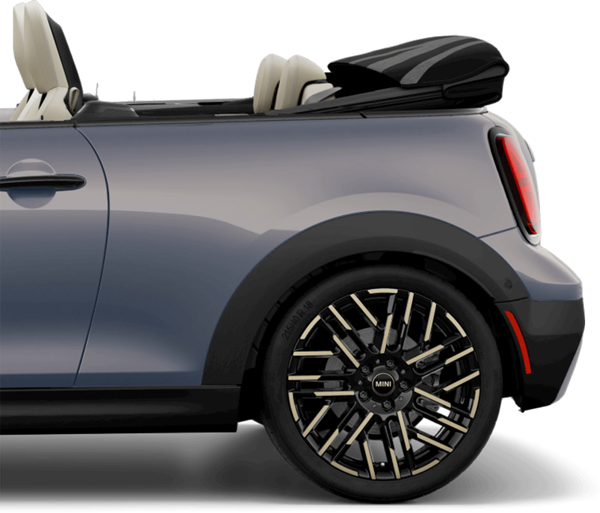 Side view of the rear of a MINI Cooper S Convertible, parked on a blank white surface with its shadow underneath it and nothing in the background.