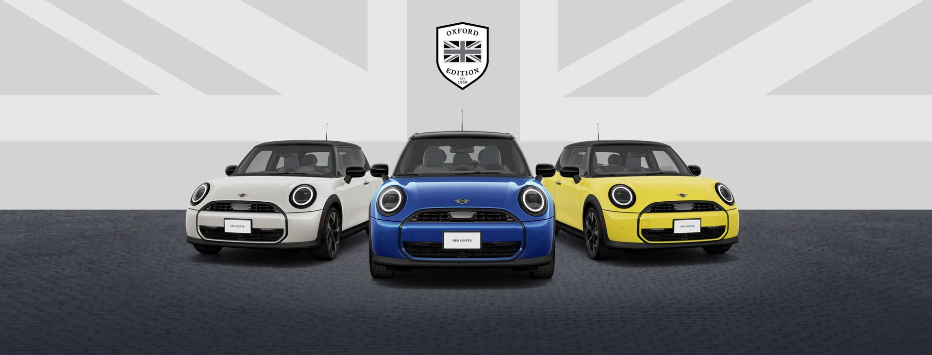Front view of three MINI Cooper Oxford Editions parked side by side