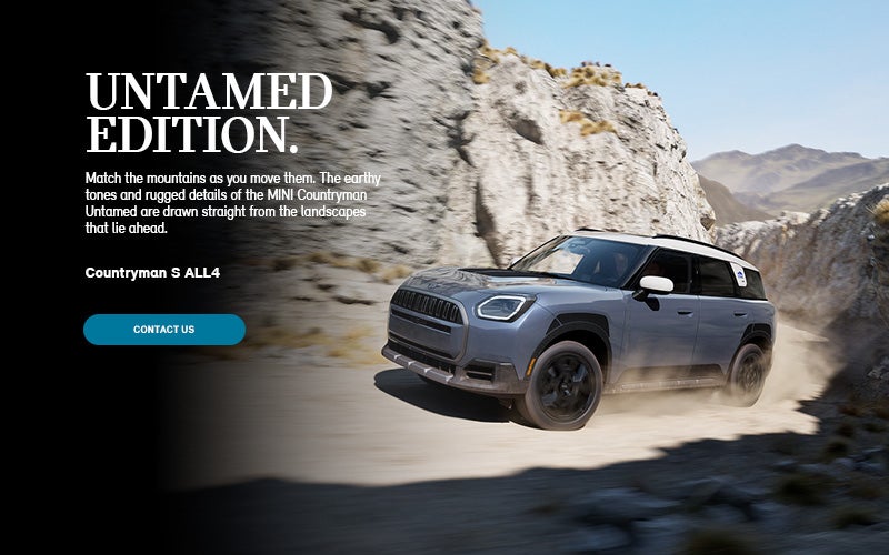 Front and side profile of Untamed Edition Countryman driving up cliff side.